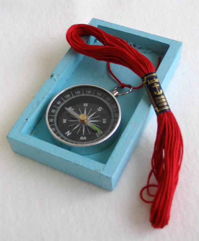 Compass, red thread, cartography, blue box, map art
